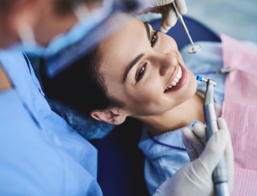 Woman receiving dental cleaning