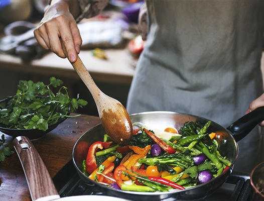 Person cooking a healthy meal