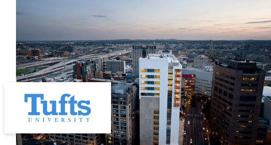 Aerial view of the Tufts University School of Dental Medicine and university logo
