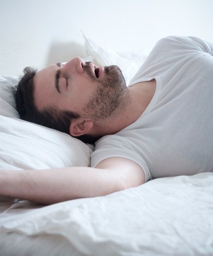 Man in need of sleep apnea therapy snoring