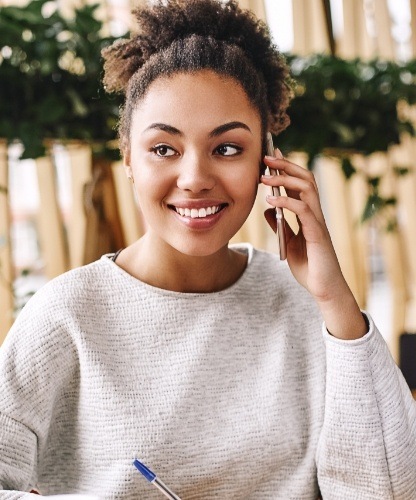 Woman with healthy smile after preventive dentistry visit