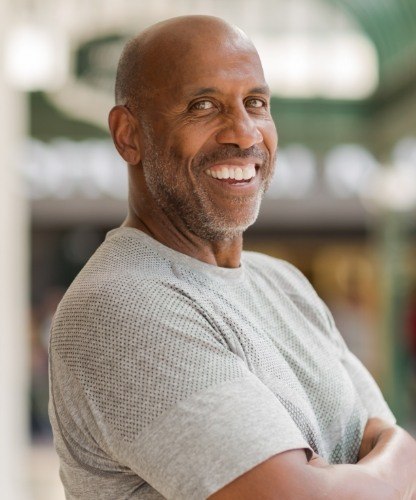 Man with healthy smile after periodontal therapy