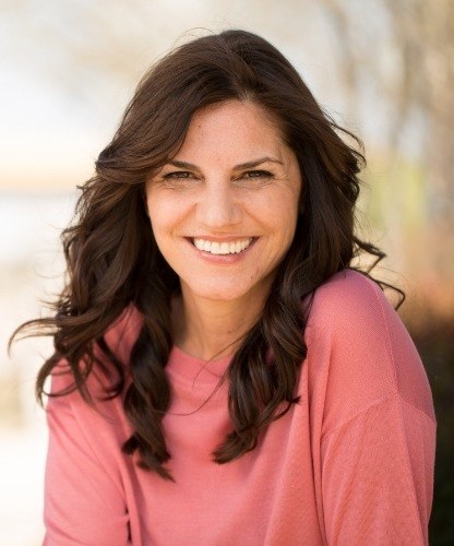 Woman with healthy smile after dental implants