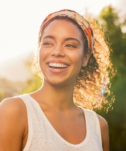 Woman with beautiful smile after cosmetic dentistry